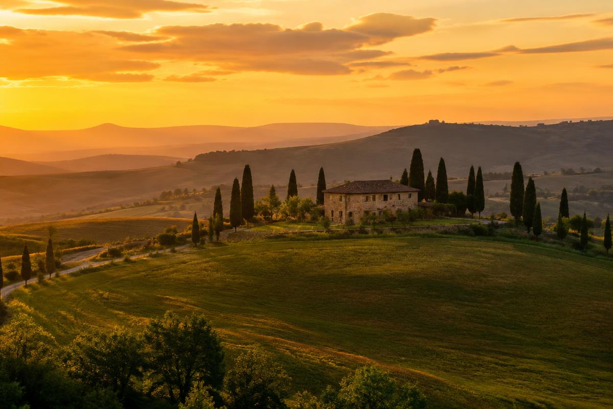 Rolling hills and cypress trees in Tuscany at sunset